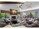 Spacious living room with high ceilings, fireplace, and leather sofas at 1118 2Nd S Ave, Tierra Verde, FL 33715
