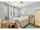 Bedroom with a wicker bed frame and coastal bedding at 17104 Carrington Park Dr # 520, Tampa, FL 33647