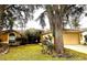 One-story house with attached garage and mature landscaping at 2321 Rothenfeld Ct, Land O Lakes, FL 34639