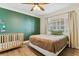 Bright bedroom with a crib and double bed at 5853 Leeland S St, St Petersburg, FL 33715