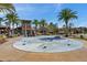 Fun splash pad feature for , surrounded by palm trees and landscaping at 1580 Bering Rd, Wesley Chapel, FL 33543