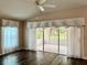 Bright sunroom with sliding glass doors and view at 739 Winterbrooke Way, Sun City Center, FL 33573