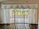 Bright sunroom with sliding glass doors and view at 739 Winterbrooke Way, Sun City Center, FL 33573
