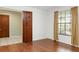 Bright bedroom with hardwood floors and ample closet space at 12917 Rain Forest St, Temple Terrace, FL 33617