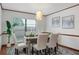 Bright dining room with large window and stylish decor at 12917 Rain Forest St, Temple Terrace, FL 33617