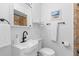 Clean bathroom featuring a white vanity and tiled shower at 13426 Gulf Blvd, Madeira Beach, FL 33708