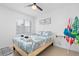 Bedroom with a queen bed and beach themed decor at 13426 Gulf Blvd, Madeira Beach, FL 33708