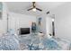 Guest bedroom with a coastal theme and ensuite bathroom access at 13426 Gulf Blvd, Madeira Beach, FL 33708