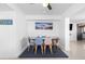 Bright dining area with a table and patterned chairs at 13426 Gulf Blvd, Madeira Beach, FL 33708