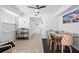 Dining area with a wooden table and modern chairs at 13426 Gulf Blvd, Madeira Beach, FL 33708