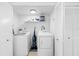 Laundry room with washer, dryer, and extra storage at 13426 Gulf Blvd, Madeira Beach, FL 33708