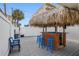 Enjoy cocktails under the tiki bar on the deck at 13426 Gulf Blvd, Madeira Beach, FL 33708