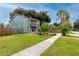 Charming two-story home with a well-manicured lawn and a welcoming front entrance at 6619 Livingston N Ave, St Petersburg, FL 33702