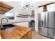 Modern kitchen featuring stainless steel appliances, wood countertops, and ample cabinet space at 6619 Livingston N Ave, St Petersburg, FL 33702