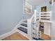 Stylish staircase leading to upper levels, featuring a laundry area underneath at 6619 Livingston N Ave, St Petersburg, FL 33702