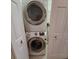 Convenient laundry room with stackable washer and dryer at 9 Pelican Pl, Belleair, FL 33756