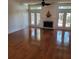 Spacious living room featuring hardwood floors and a fireplace at 9 Pelican Pl, Belleair, FL 33756