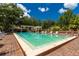 Inviting community pool area with lounge chairs at 9 Pelican Pl, Belleair, FL 33756