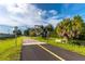 Community paved path, trees and greenery at 9 Pelican Pl, Belleair, FL 33756