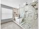 Modern bathroom with freestanding tub and glass shower at 12506 Ashdown Dr, Odessa, FL 33556