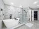 Stunning bathroom featuring a freestanding tub and shower at 12506 Ashdown Dr, Odessa, FL 33556