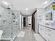Large bathroom with double vanity and a walk-in shower at 12506 Ashdown Dr, Odessa, FL 33556