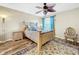 Bright bedroom with wood floors and ceiling fan at 12506 Ashdown Dr, Odessa, FL 33556