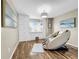 Relaxing bedroom with built-in window seat and massage chair at 12506 Ashdown Dr, Odessa, FL 33556