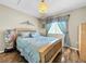 Charming bedroom with wood floors and a large dresser at 12506 Ashdown Dr, Odessa, FL 33556