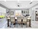 Bright dining room with a large table and hardwood floors at 12506 Ashdown Dr, Odessa, FL 33556