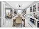 Spacious dining room with a large table and access to kitchen at 12506 Ashdown Dr, Odessa, FL 33556