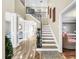 Elegant entryway with a grand staircase and hardwood floors at 12506 Ashdown Dr, Odessa, FL 33556