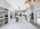 Bright kitchen features white cabinets, marble flooring, and a large walk-in pantry at 12506 Ashdown Dr, Odessa, FL 33556