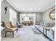 Living room with marble floors, comfortable seating, and views to dining area at 12506 Ashdown Dr, Odessa, FL 33556