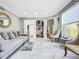 Bright living room with marble floors and comfortable seating at 12506 Ashdown Dr, Odessa, FL 33556