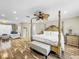 Bright main bedroom with a king bed and ceiling fan at 12506 Ashdown Dr, Odessa, FL 33556