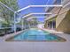 Inviting screened pool with ample deck space for entertaining at 12506 Ashdown Dr, Odessa, FL 33556