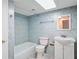 Clean bathroom with a tub, toilet and vanity at 3600 Landale Dr, Holiday, FL 34691