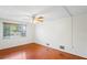 Large bedroom with hardwood floors and ceiling fan at 3600 Landale Dr, Holiday, FL 34691