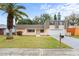 Cute ranch-style home with a well-maintained lawn and attached garage at 3600 Landale Dr, Holiday, FL 34691