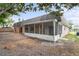Rear view of the house, showing screened porch at 3600 Landale Dr, Holiday, FL 34691
