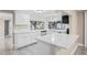 Newly renovated kitchen featuring white cabinets and new appliances at 3600 Landale Dr, Holiday, FL 34691