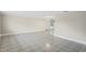 Open living room with neutral walls and tile flooring at 3600 Landale Dr, Holiday, FL 34691