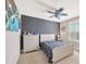This bedroom features a space themed paint and decor, creating a fun and creative atmosphere at 16462 Courtyard Loop, Land O Lakes, FL 34638
