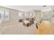 Bright bonus room with a comfortable couch, a built-in desk, and modern decor at 16462 Courtyard Loop, Land O Lakes, FL 34638