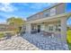 Covered patio with ceiling fan and outdoor furniture, perfect for relaxing and entertaining at 16462 Courtyard Loop, Land O Lakes, FL 34638