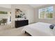Main bedroom with dresser, large window and view to living room at 4251 Preserve Pl, Palm Harbor, FL 34685