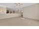 Spacious bedroom with high ceilings and access to upper hallway at 4251 Preserve Pl, Palm Harbor, FL 34685