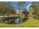 Waterfront community with lush landscaping and townhouses at 4251 Preserve Pl, Palm Harbor, FL 34685