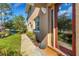 Condo's exterior entrance with a red door and walkway at 4251 Preserve Pl, Palm Harbor, FL 34685